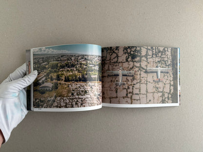 Soviet Transport open spread with an aerial city view and rows of abandoned train cars