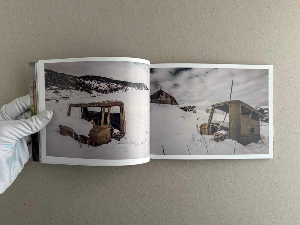 Soviet Transport open spread showing two snow-covered abandoned vehicle cabins in a landscape
