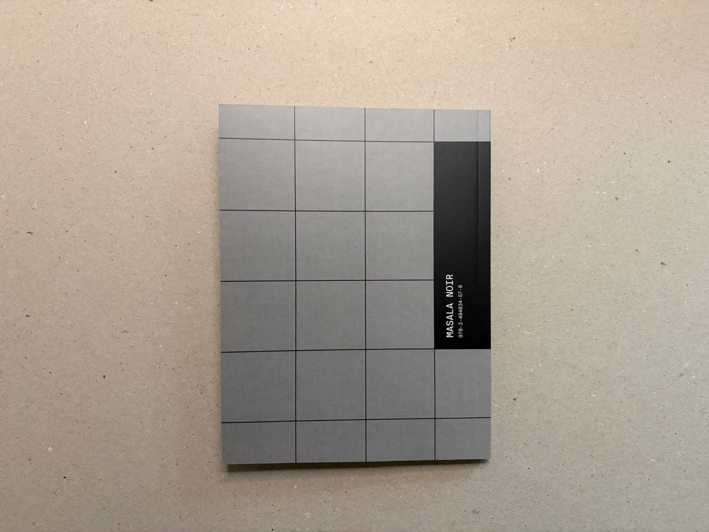 Back cover of Speed Metal Logos (1990–2020), grey grid with a black band carrying Masala Noir and ISBN text