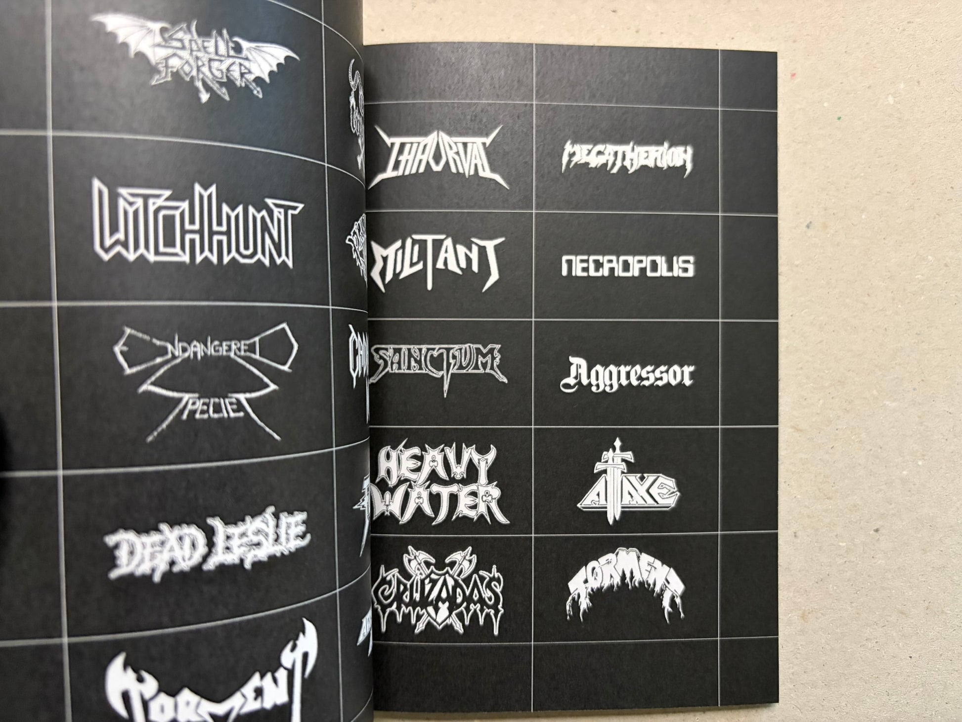 Open spread with more speed metal logo samples, including bat-wing and angular lettering forms