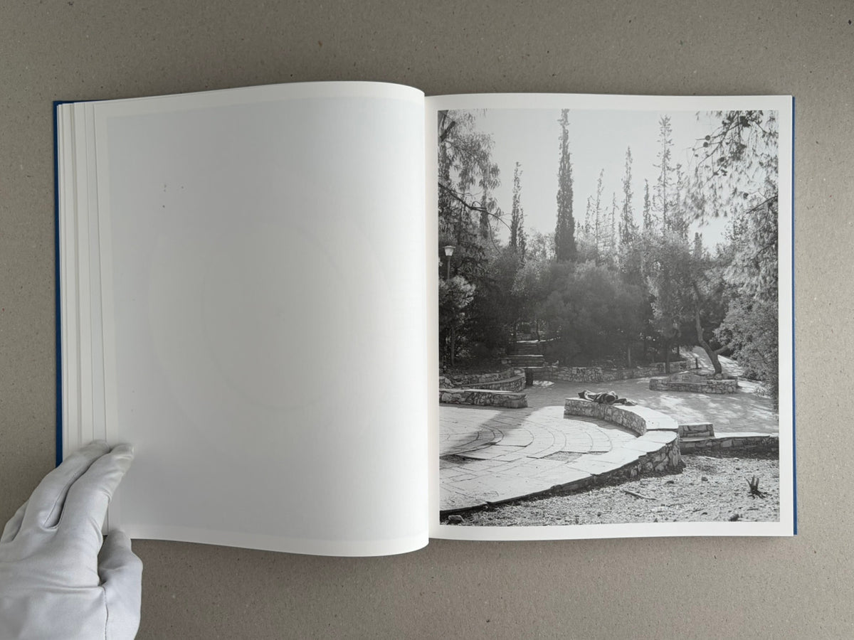 Open spread of Sub Sole by Massao Mascaro, showing a blank left page and a black-and-white landscape photograph on the right page.
