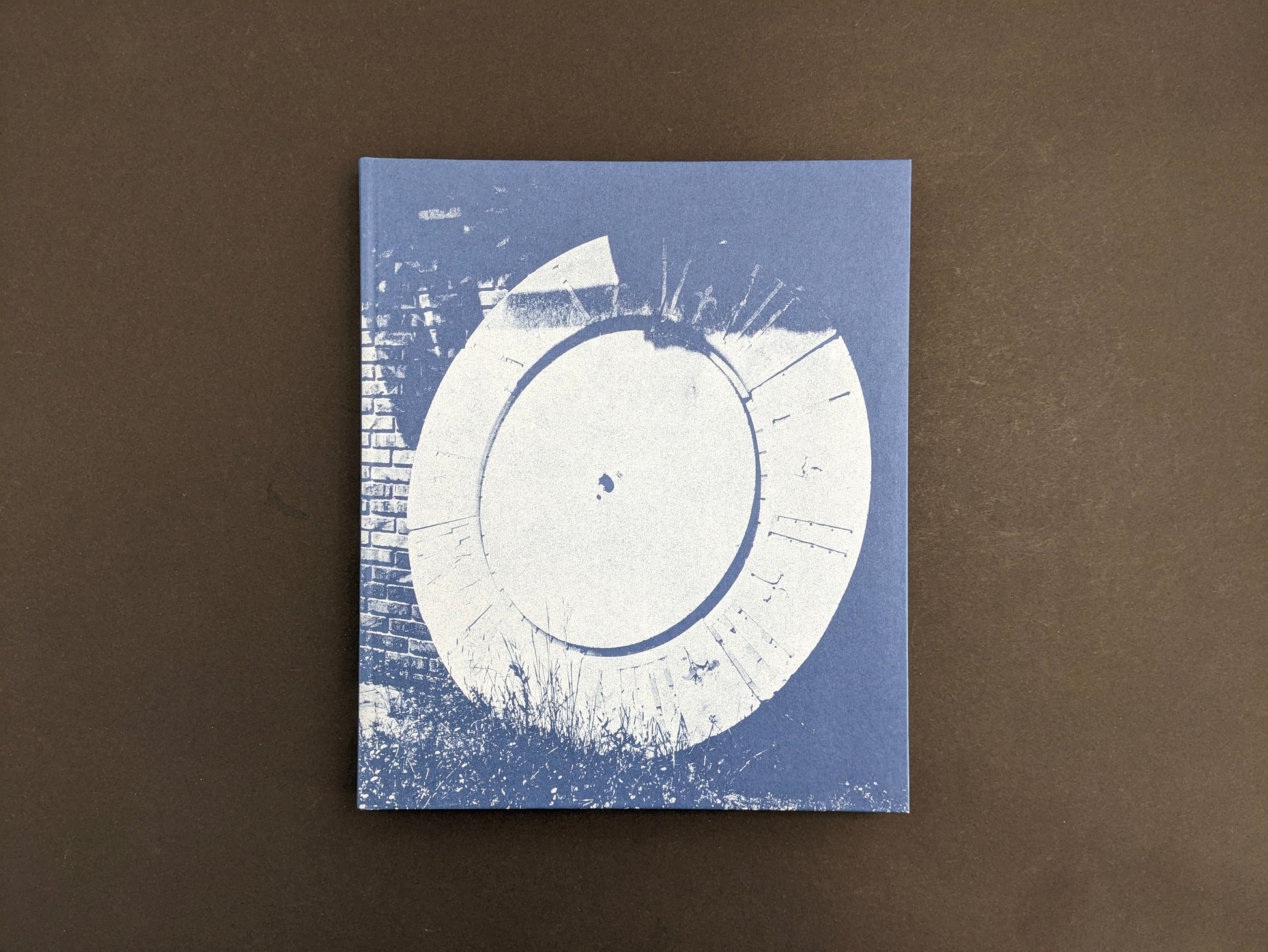 Front cover of Sub Sole by Massao Mascaro, blue cover featuring a monochrome image of a large circular object.