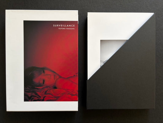 Surveillance by Tsutomu Yamagata shown with the outer case and enclosed portfolio.