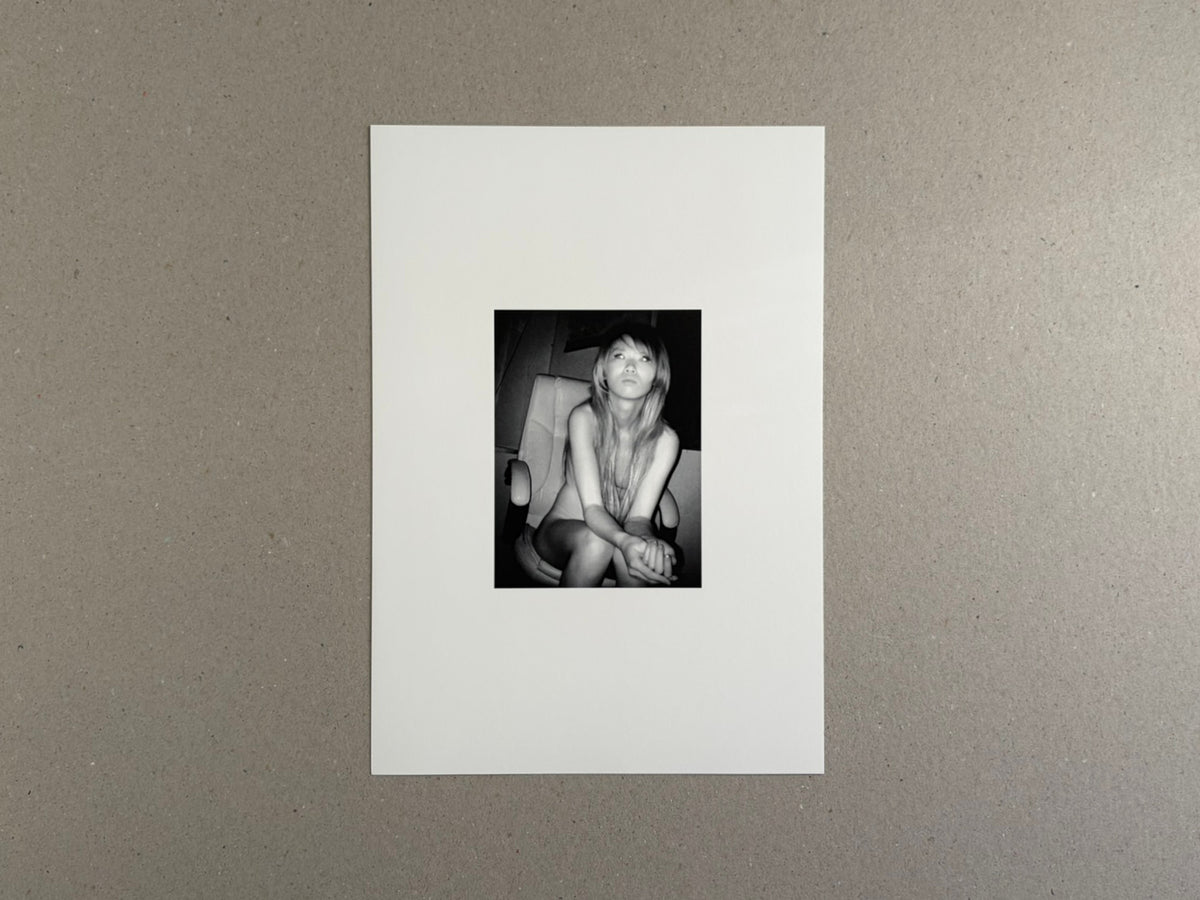 Surveillance – Tsutomu Yamagata, white cover with a small black-and-white portrait photograph centered on the front.
