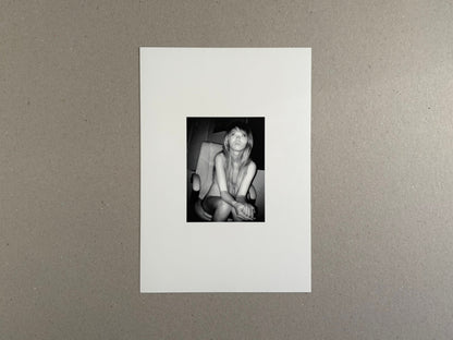 Surveillance – Tsutomu Yamagata, white cover with a small black-and-white portrait photograph centered on the front.