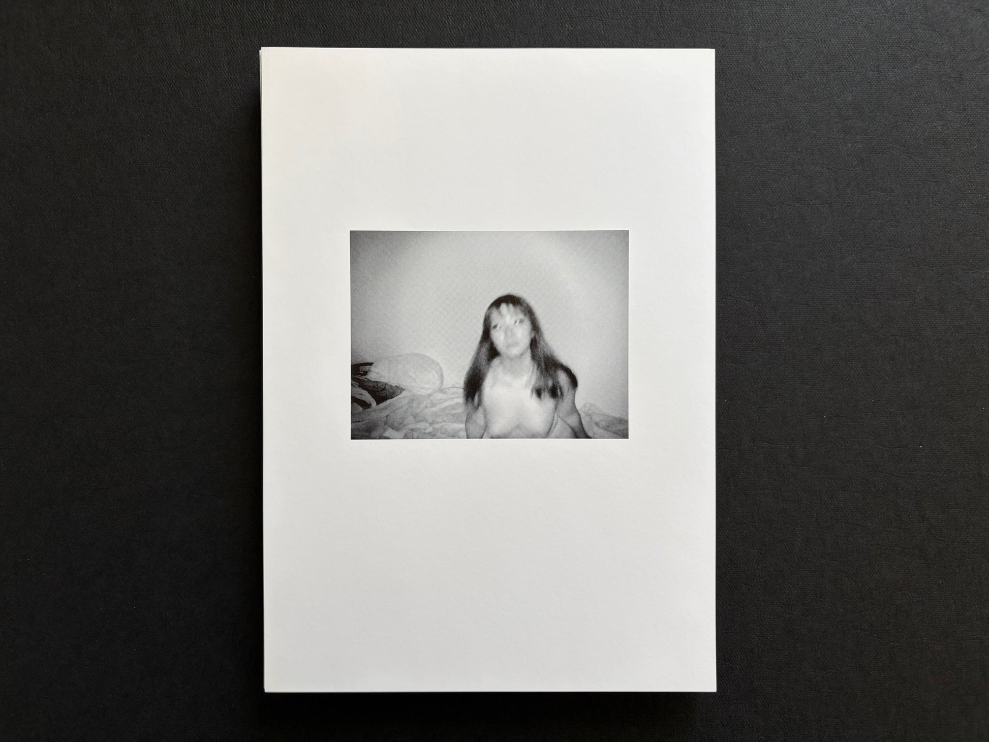 Loose photographic plate from Surveillance showing a seated infrared portrait.