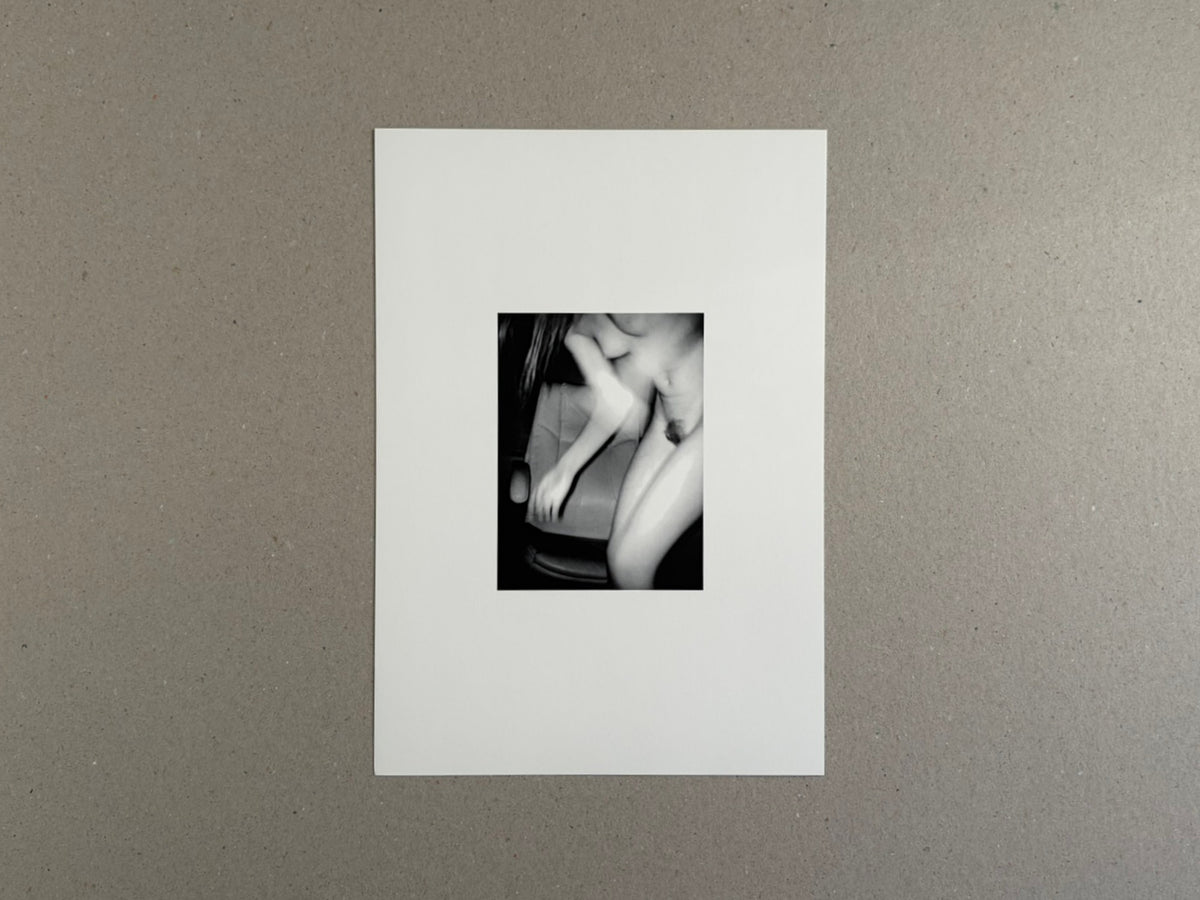 Surveillance – Tsutomu Yamagata, printed on a white sheet with a small black-and-white image centered on the page.