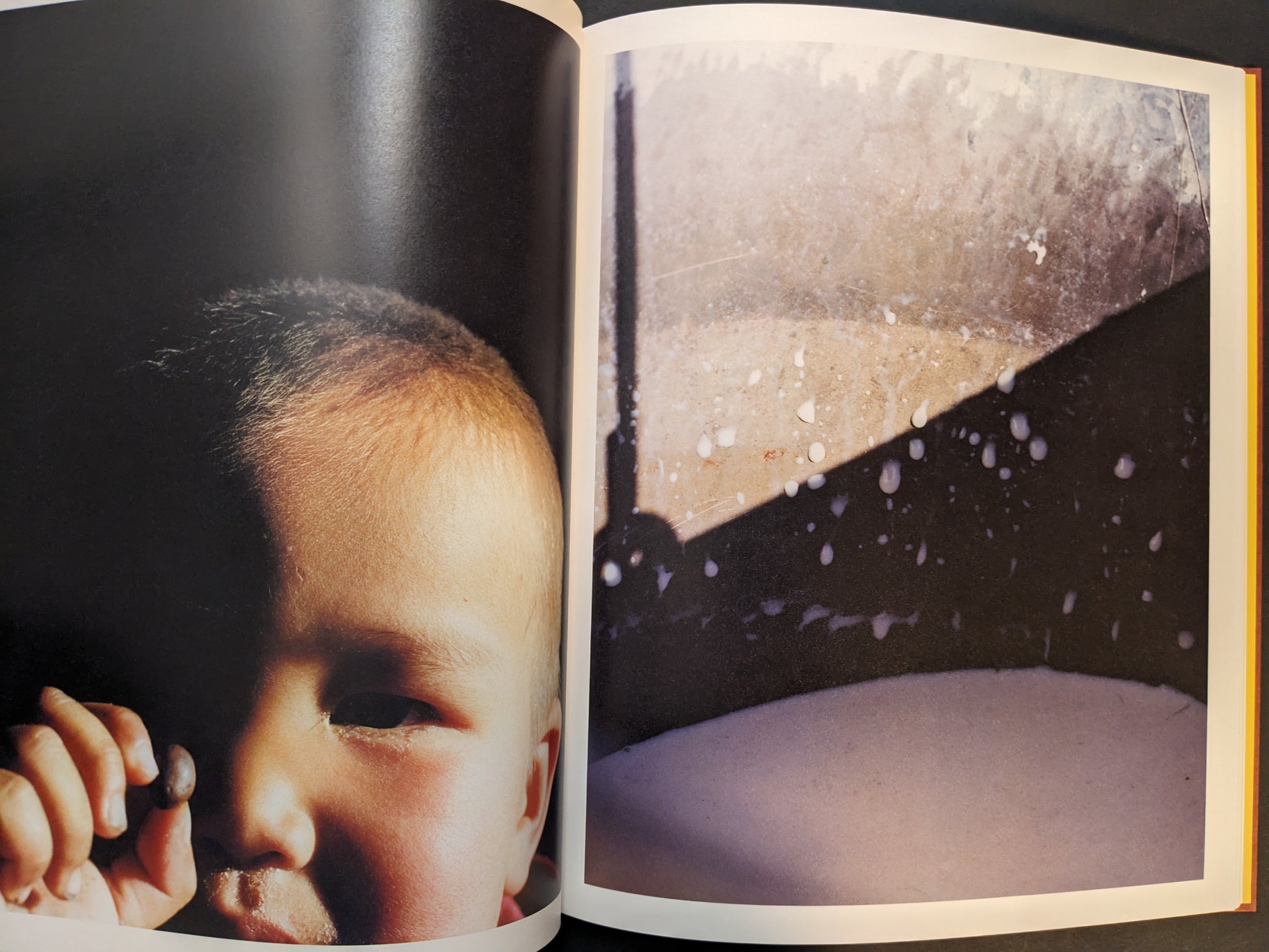Spread combining a close-up of a child holding a small object with a winter scene of light, snow, and droplets on glass.