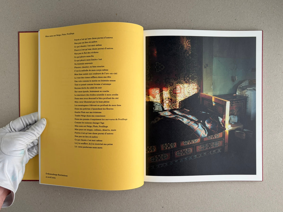 Open spread of süü – Taemin Ha, showing a yellow poem page on the left and a dark interior photograph on the right.