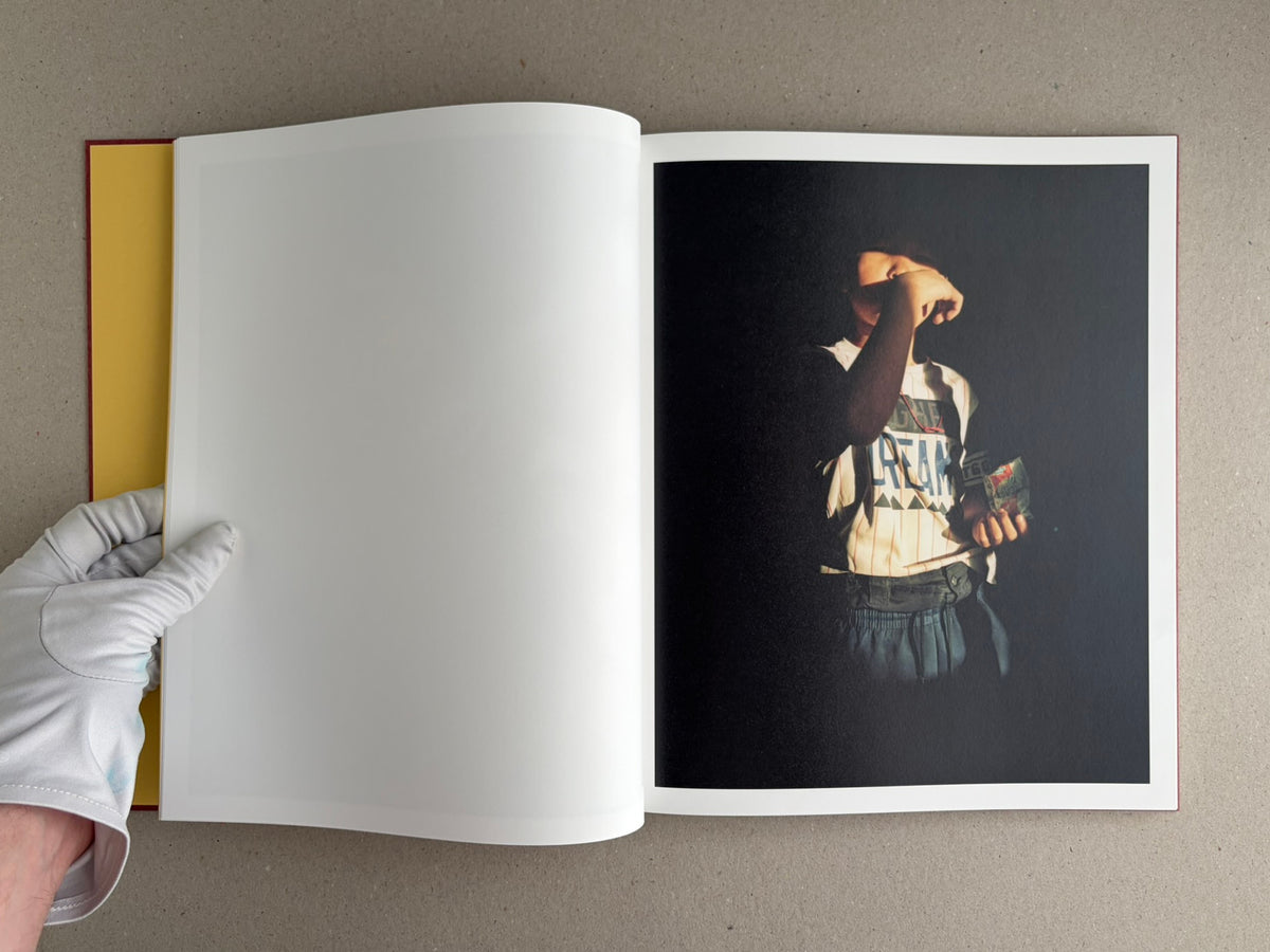Open spread of süü – Taemin Ha, with a blank left page and a dark portrait on the right page.