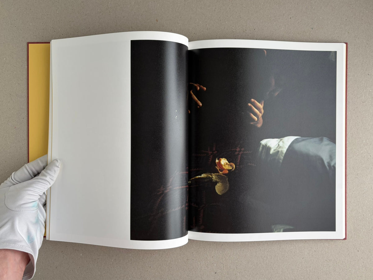 Open photobook spread from süü – Taemin Ha, showing a blank left page and a dark full-bleed photograph on the right page.