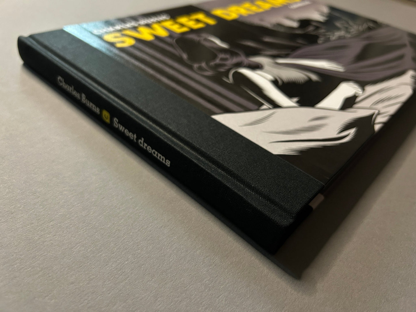 Sweet Dreams hardcover lying at an angle, showing the cloth spine and cover illustration.