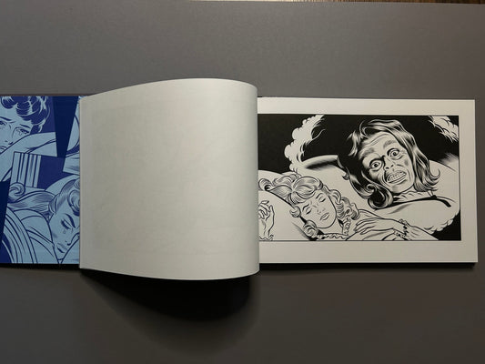 Sweet Dreams open to black-and-white interior art, with a sleeping woman on the right-hand page.