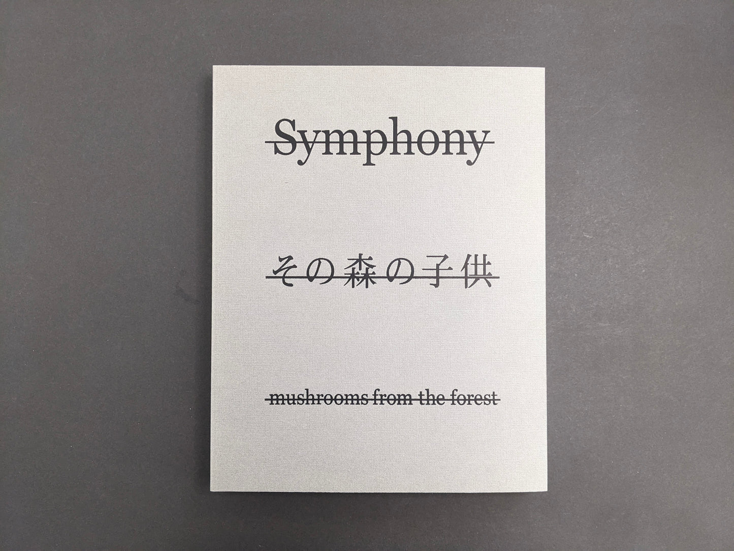 Front cover of Symphony – mushrooms from the forest by Takashi Homma with title and Japanese script