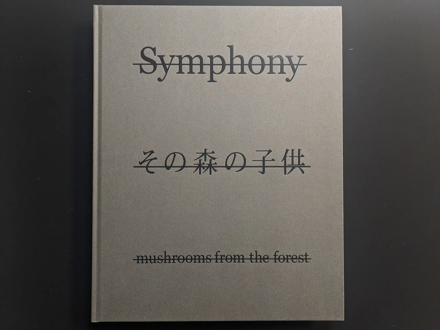 Front cover of Symphony – mushrooms from the forest by Takashi Homma with title and Japanese script