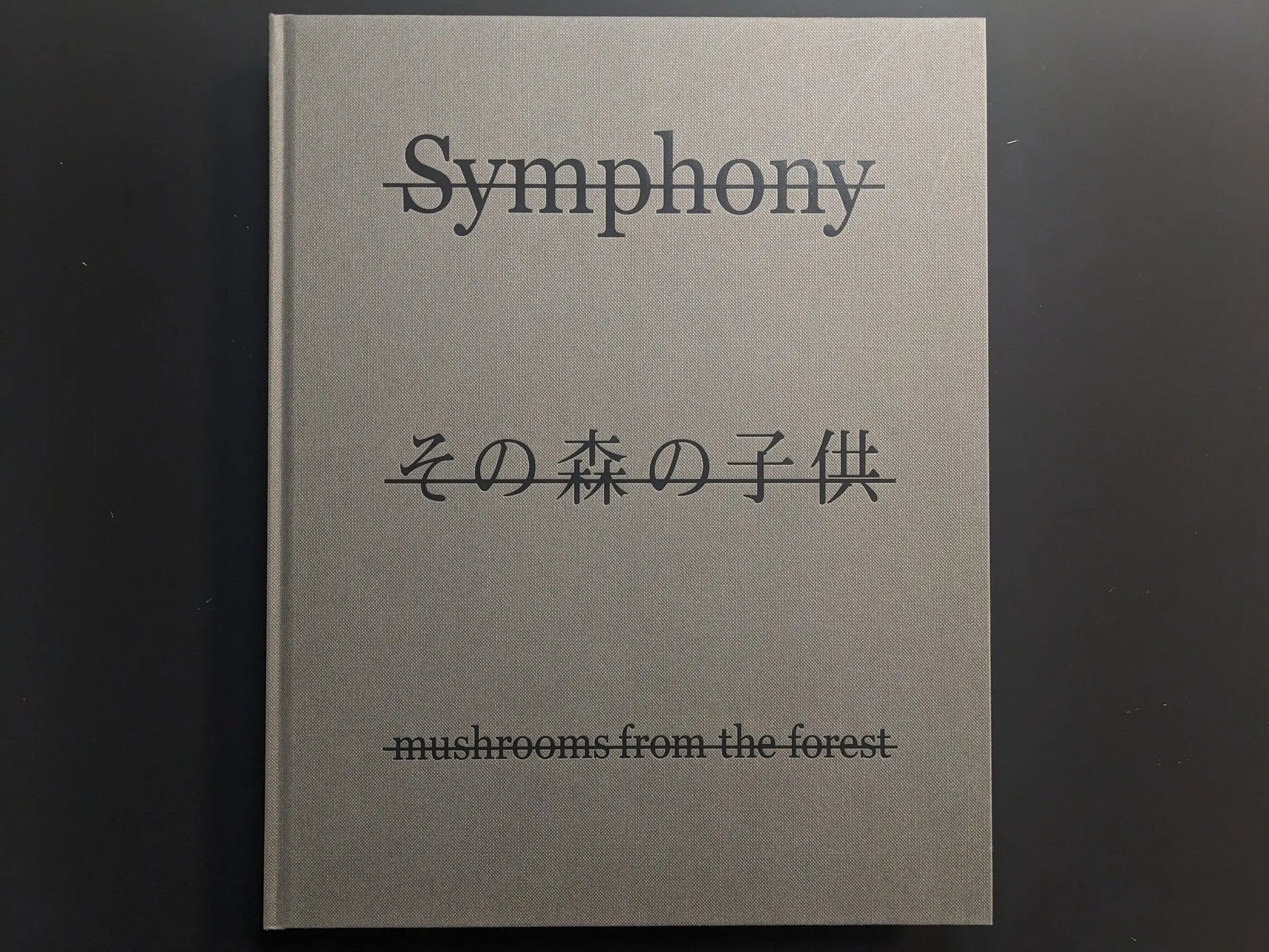 Front cover of Symphony – mushrooms from the forest by Takashi Homma with title and Japanese script
