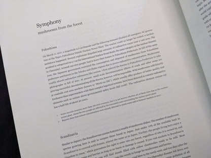 Text spread describing the Fukushima nuclear disaster and its ecological impact