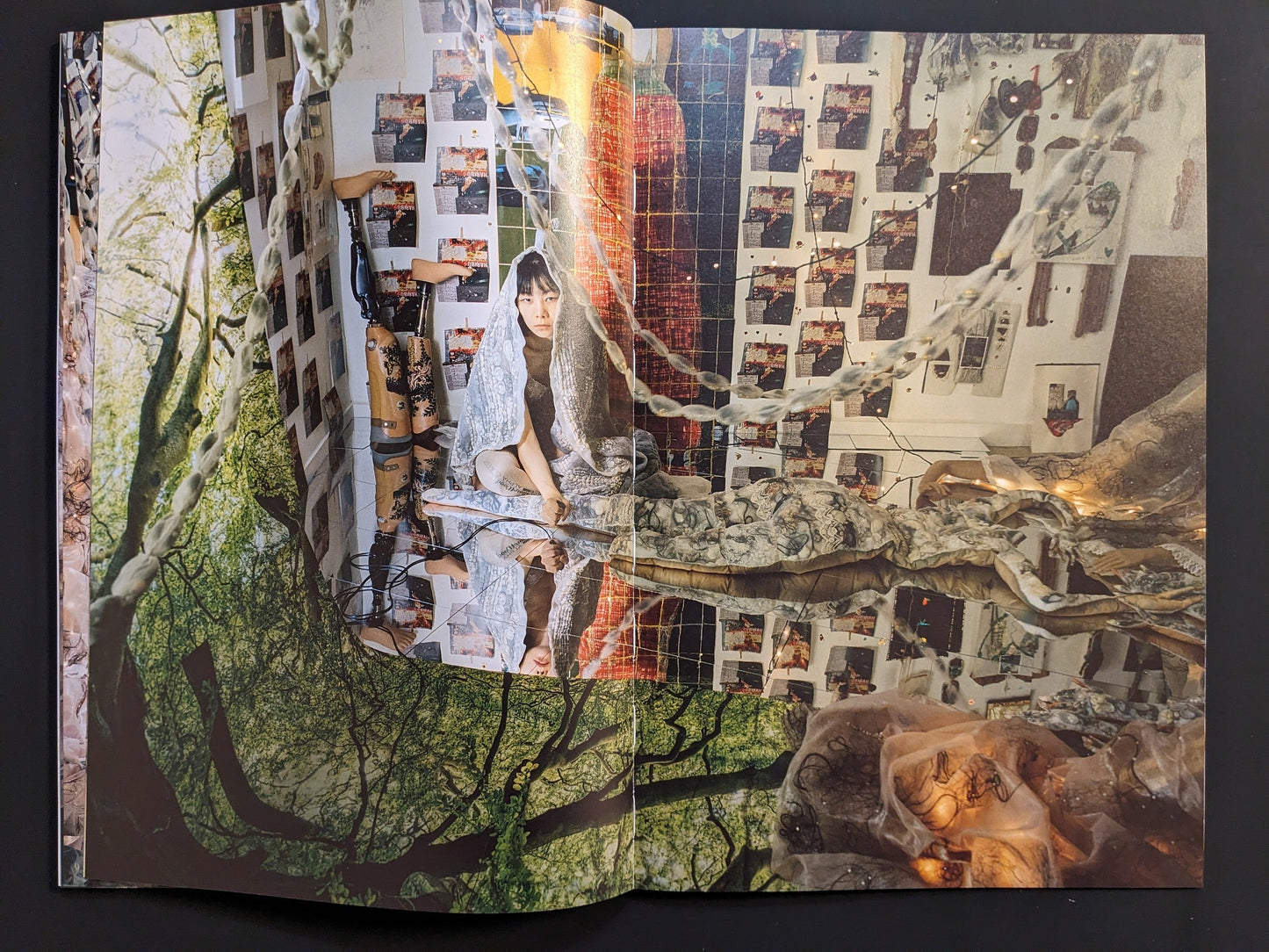 Fabric sculptures and tree imagery around a self-portrait in the studio