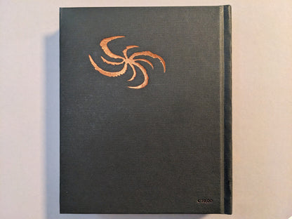 Back cover of Teratoid Heights Museum Edition by Mat Brinkman, bronze foil on black canvas