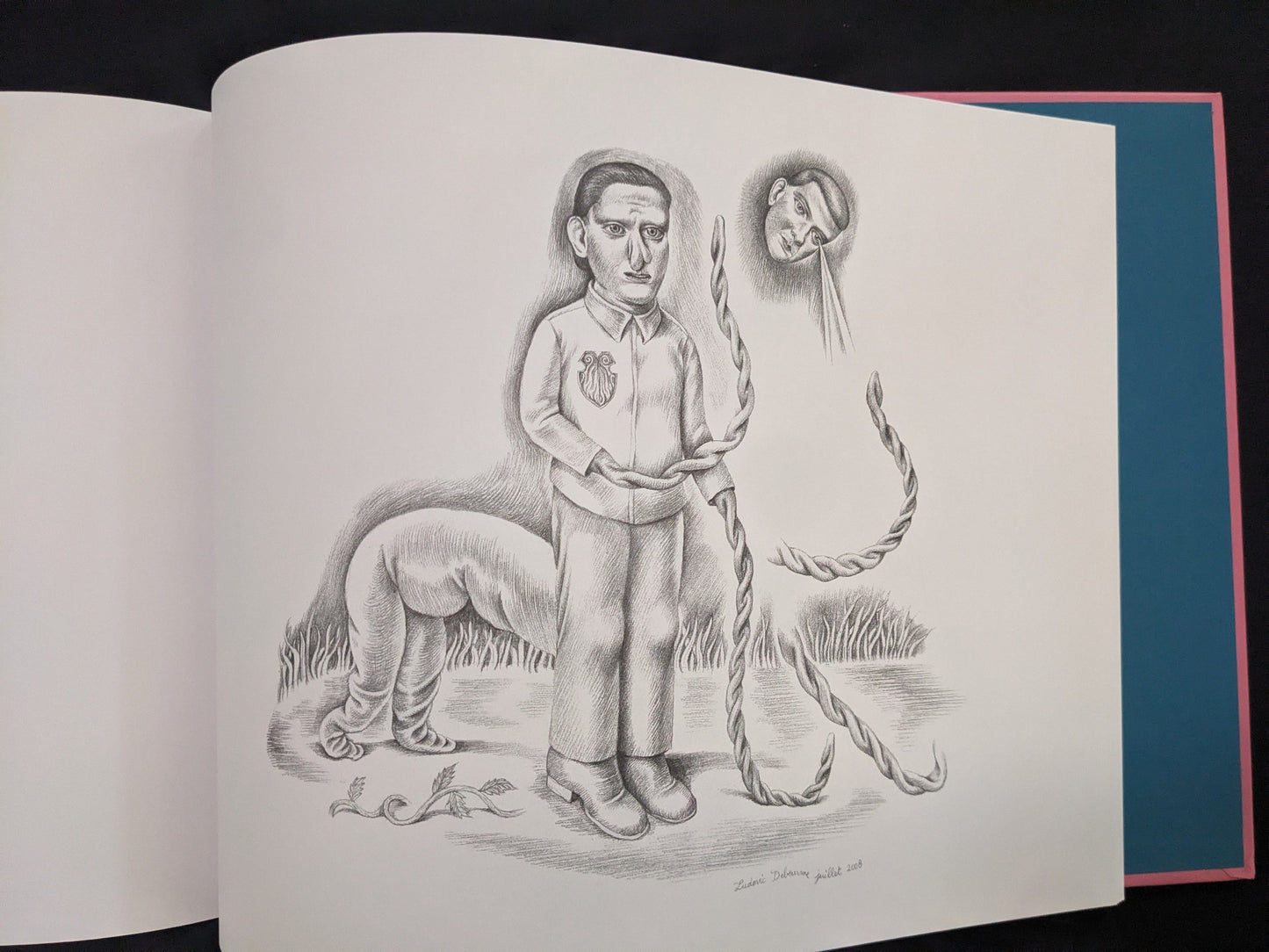 Open Terra Maxima spread with several grotesque pencil figures and a floating head
