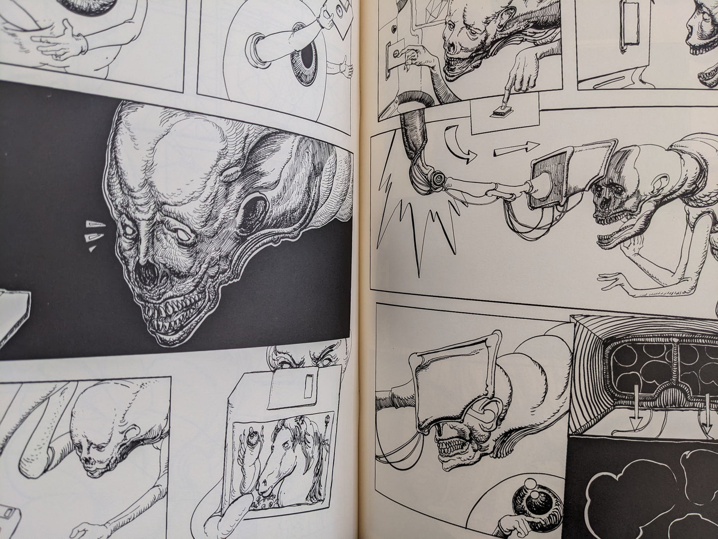 Interior spread from Terrotic with a dense cityscape of screens, machinery, and small figures in black-and-white.