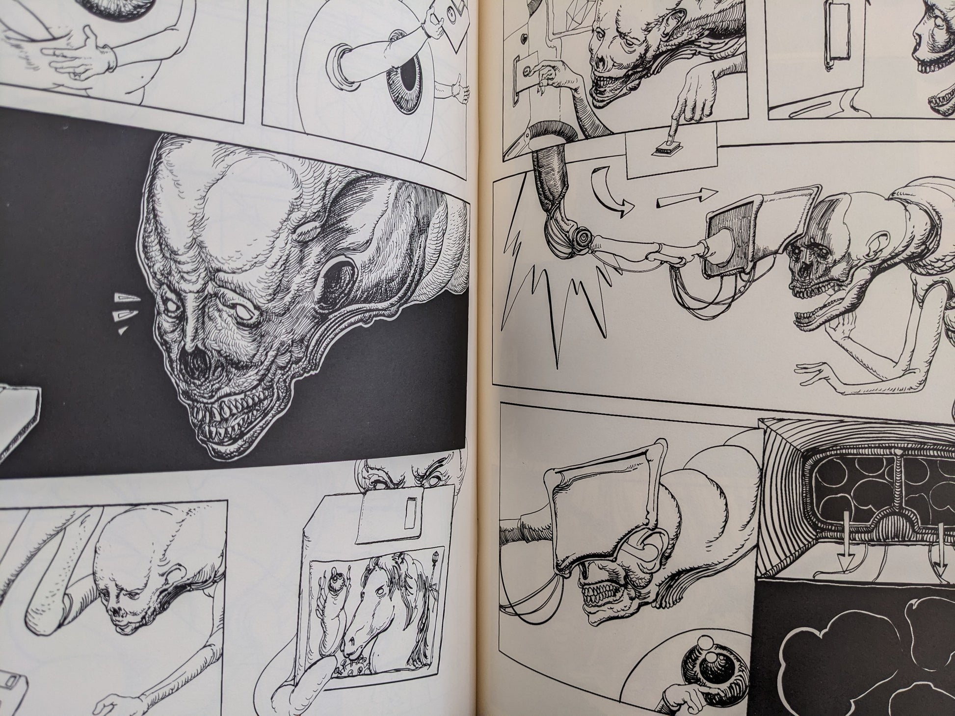 Interior spread from Terrotic with a dense cityscape of screens, machinery, and small figures in black-and-white.