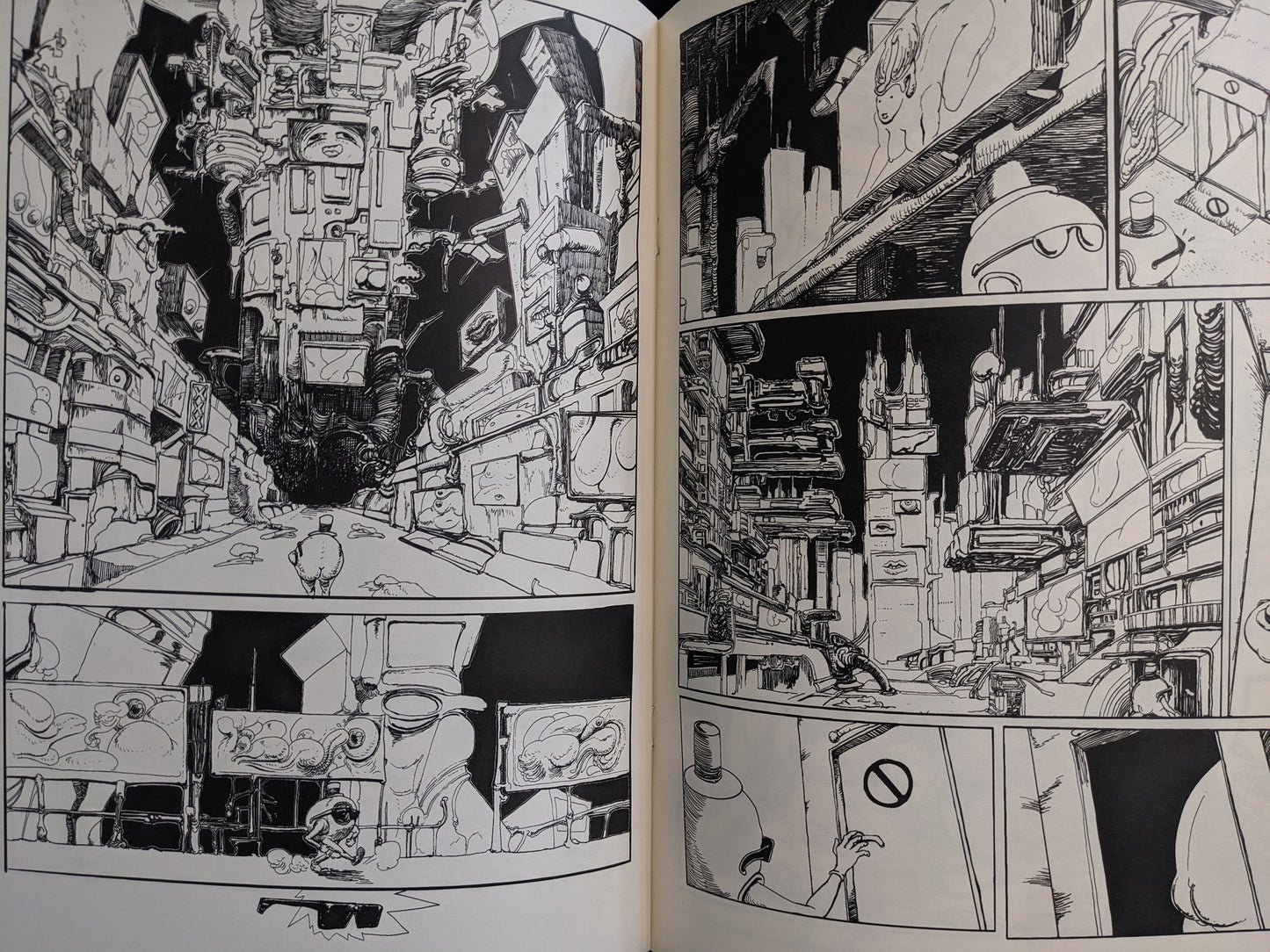 Interior spread from Terrotic showing a collapsing city of screens, billboards, and post-human figures.