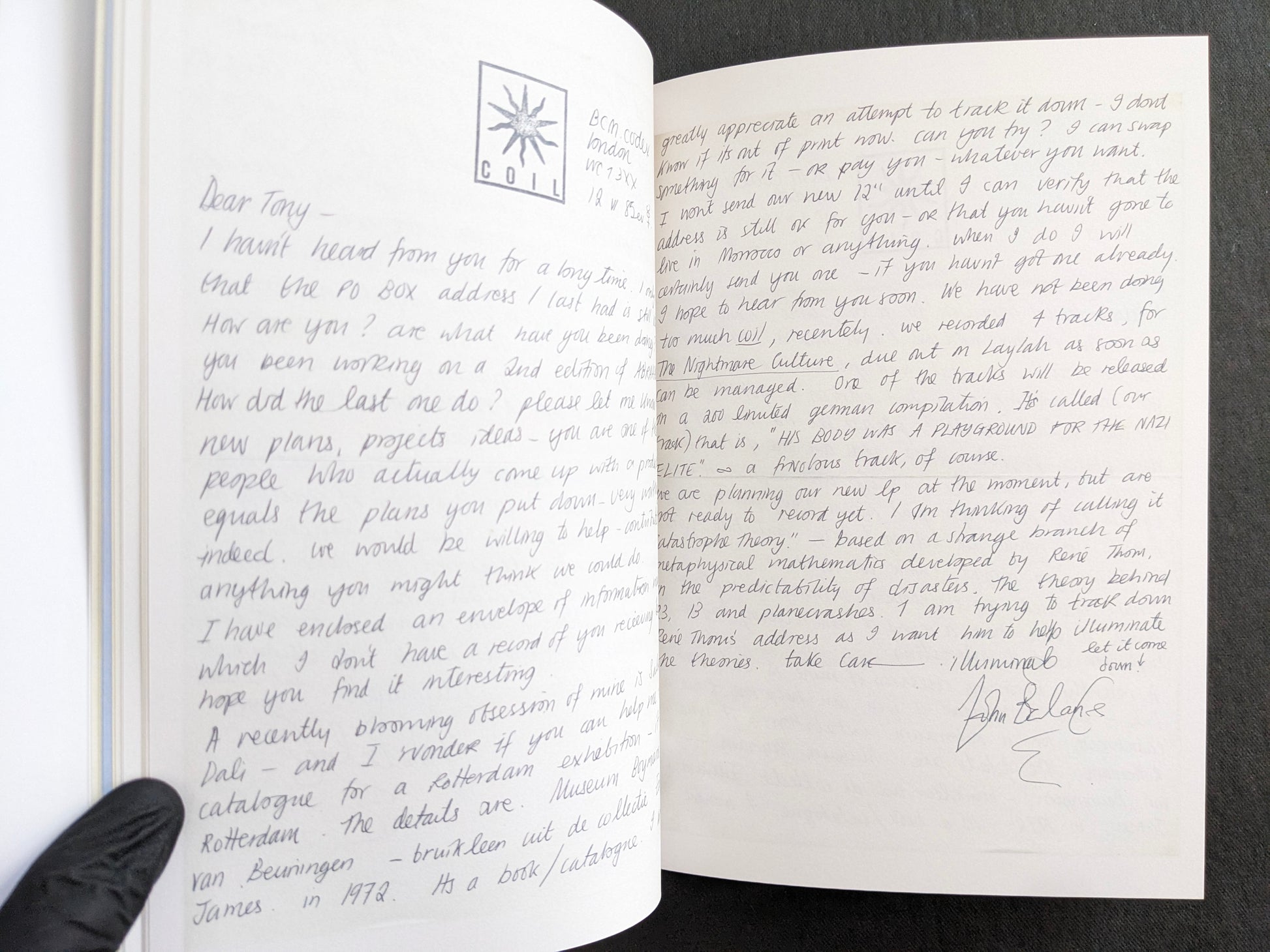 Interior spread featuring a handwritten John Balance letter across two pages, with COIL stationery marks and signature.