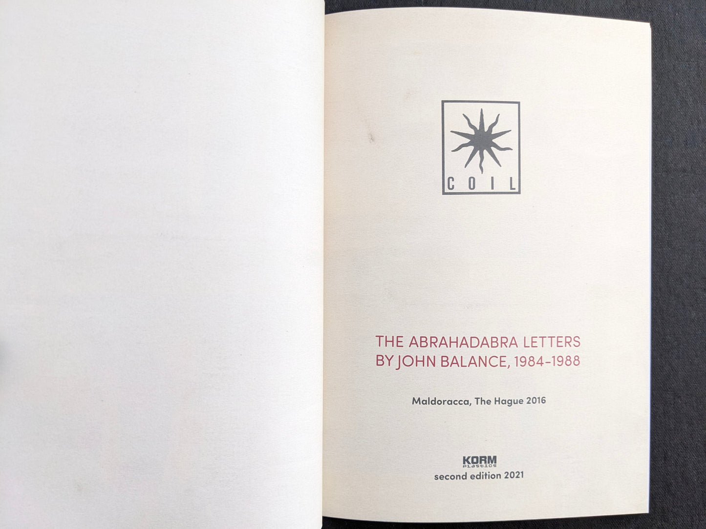 Title page of The Abrahadabra Letters by John Balance, 1984–1988, showing the COIL logo and publication details.