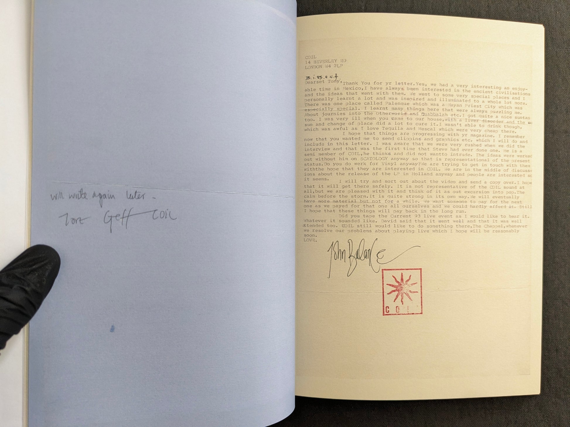 Interior spread with a typed John Balance letter on the right page, signed with the COIL stamp, and a pencilled note on the left page.
