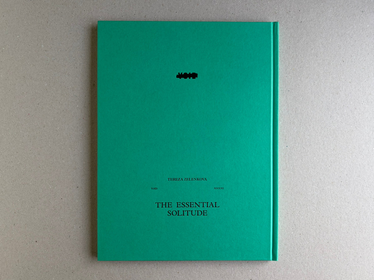 The Essential Solitude back cover on a turquoise hardcover with title and author text.