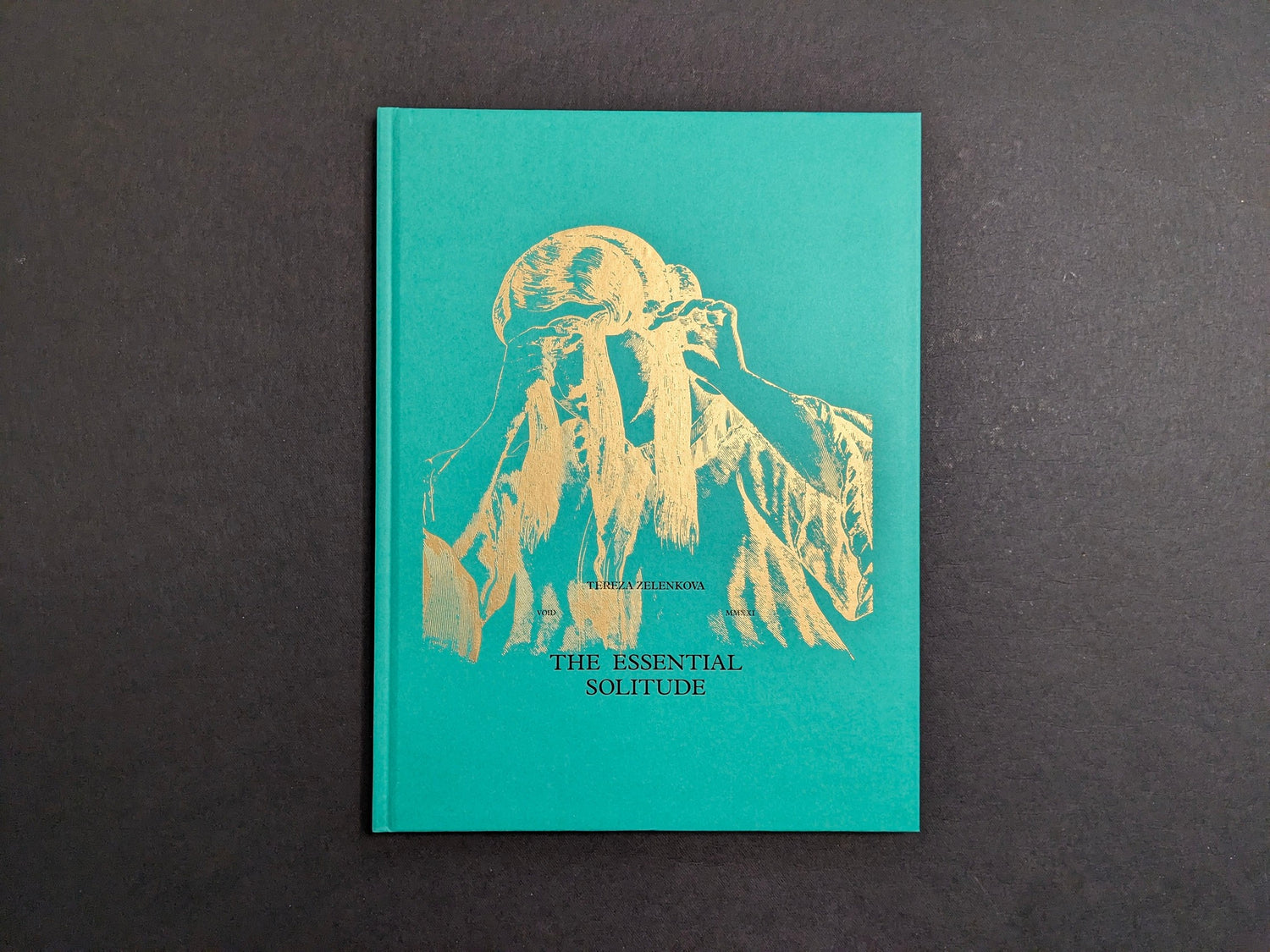 Front cover of The Essential Solitude by Tereza Zelenkova, green hardcover with a gold illustration.