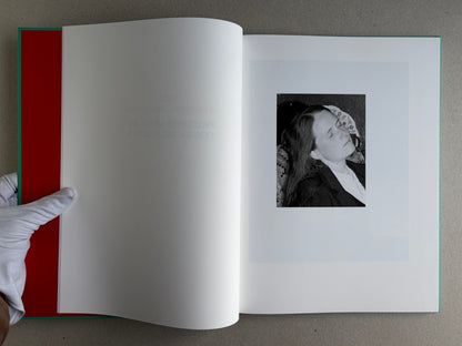 The Essential Solitude open to the title spread, with a small black-and-white portrait on the right page.