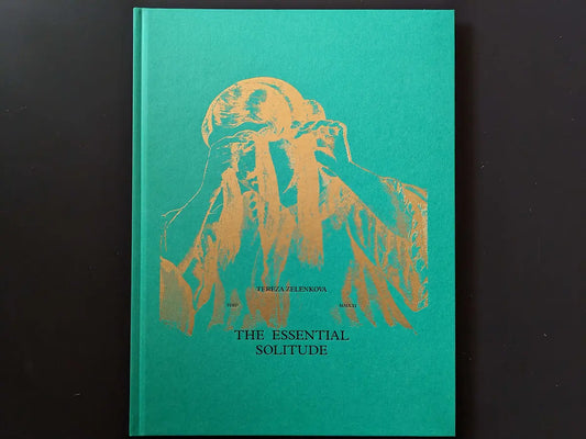 Front cover of The Essential Solitude with gold-foil figure on green cloth board.