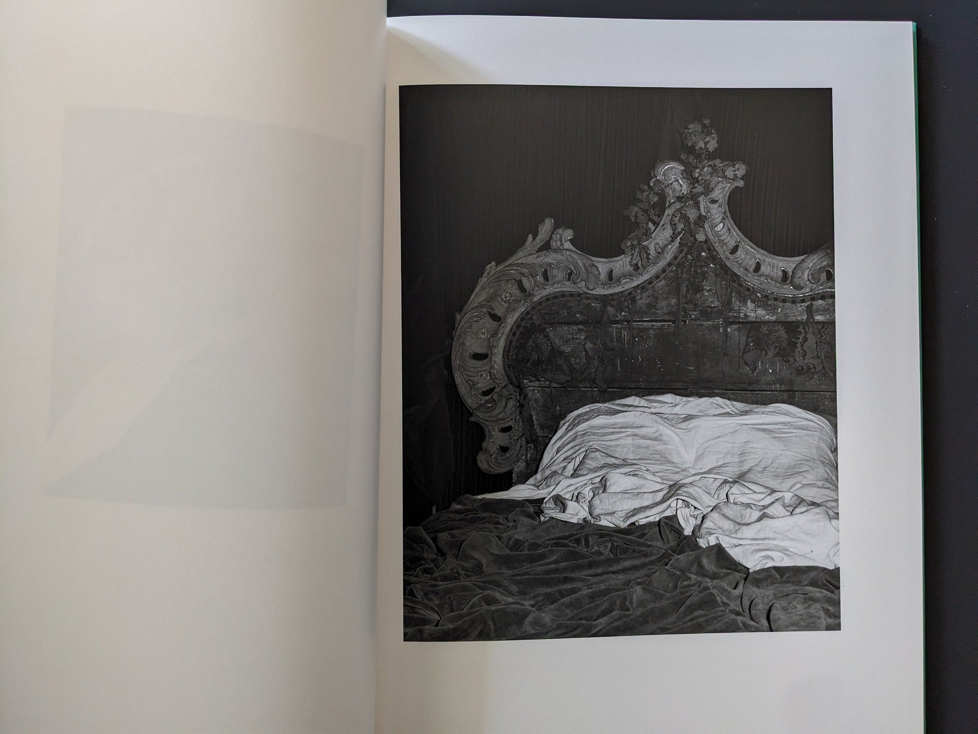 Interior spread: unmade bed, velvet folds and ornate baroque headboard in low light.