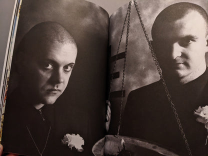 Black and white portrait of Genesis P-Orridge and Peter Christopherson with flowers