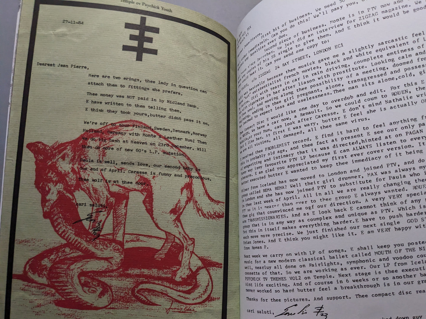 Interior page with a typewritten letter and red wolf and snake illustration.