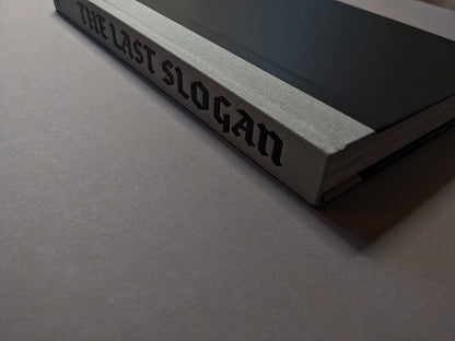 Book spine with title 'The Last Slogan' in gothic typeface