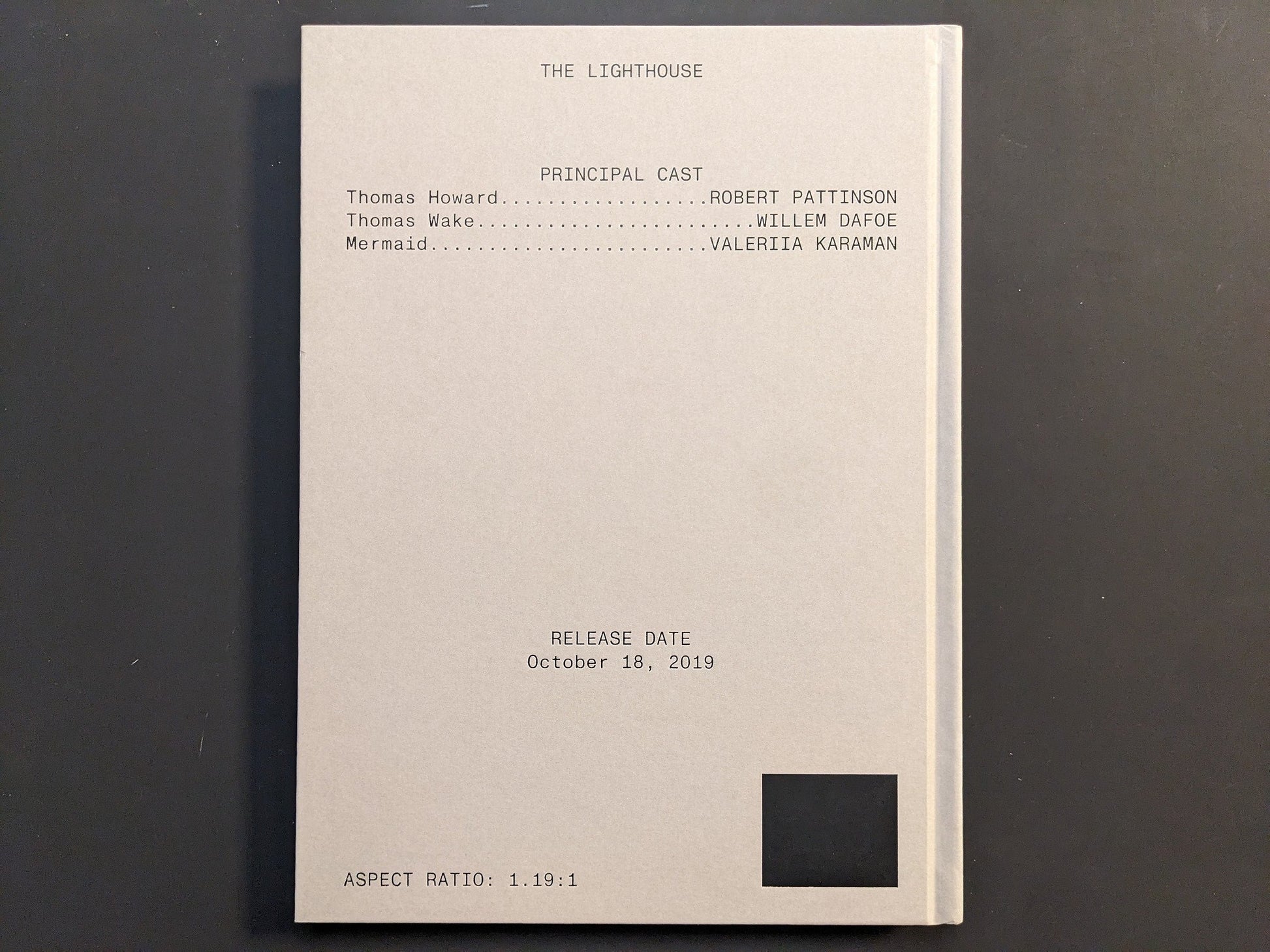 Back cover of The Lighthouse Screenplay Book with minimalist typography and film credits.