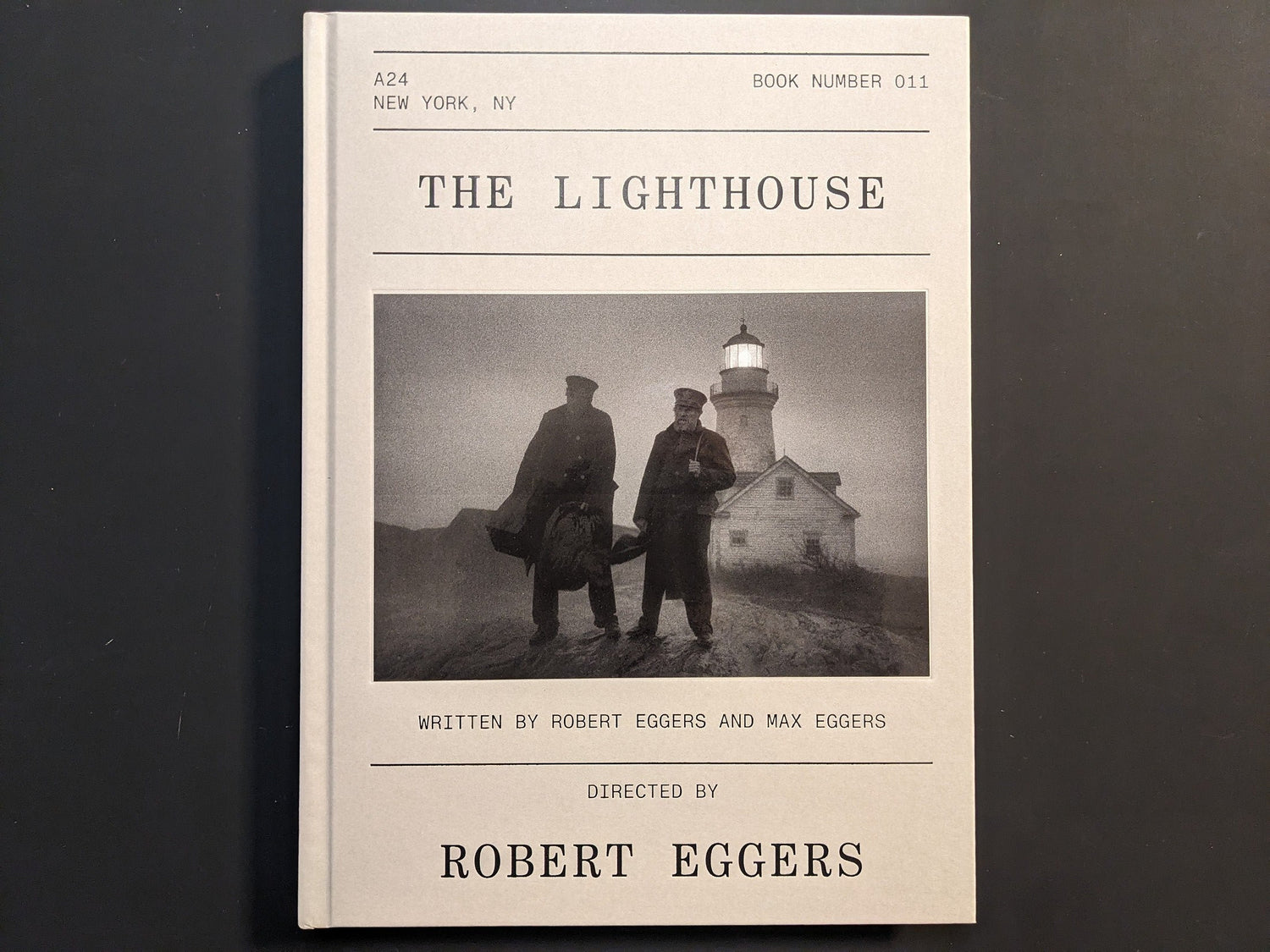 Front cover of The Lighthouse Screenplay Book with Robert Pattinson and Willem Dafoe.