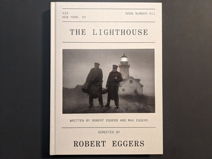 Front cover of The Lighthouse Screenplay Book featuring Robert Pattinson and Willem Dafoe photograph.