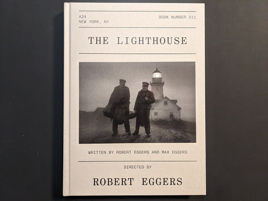 Front cover of The Lighthouse Screenplay Book featuring Robert Pattinson and Willem Dafoe photograph.