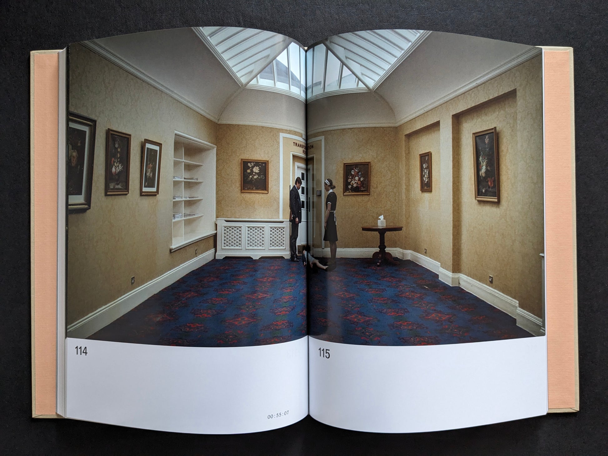 Interior spread with a film still from The Lobster showing a wide hotel corridor with David and a maid.