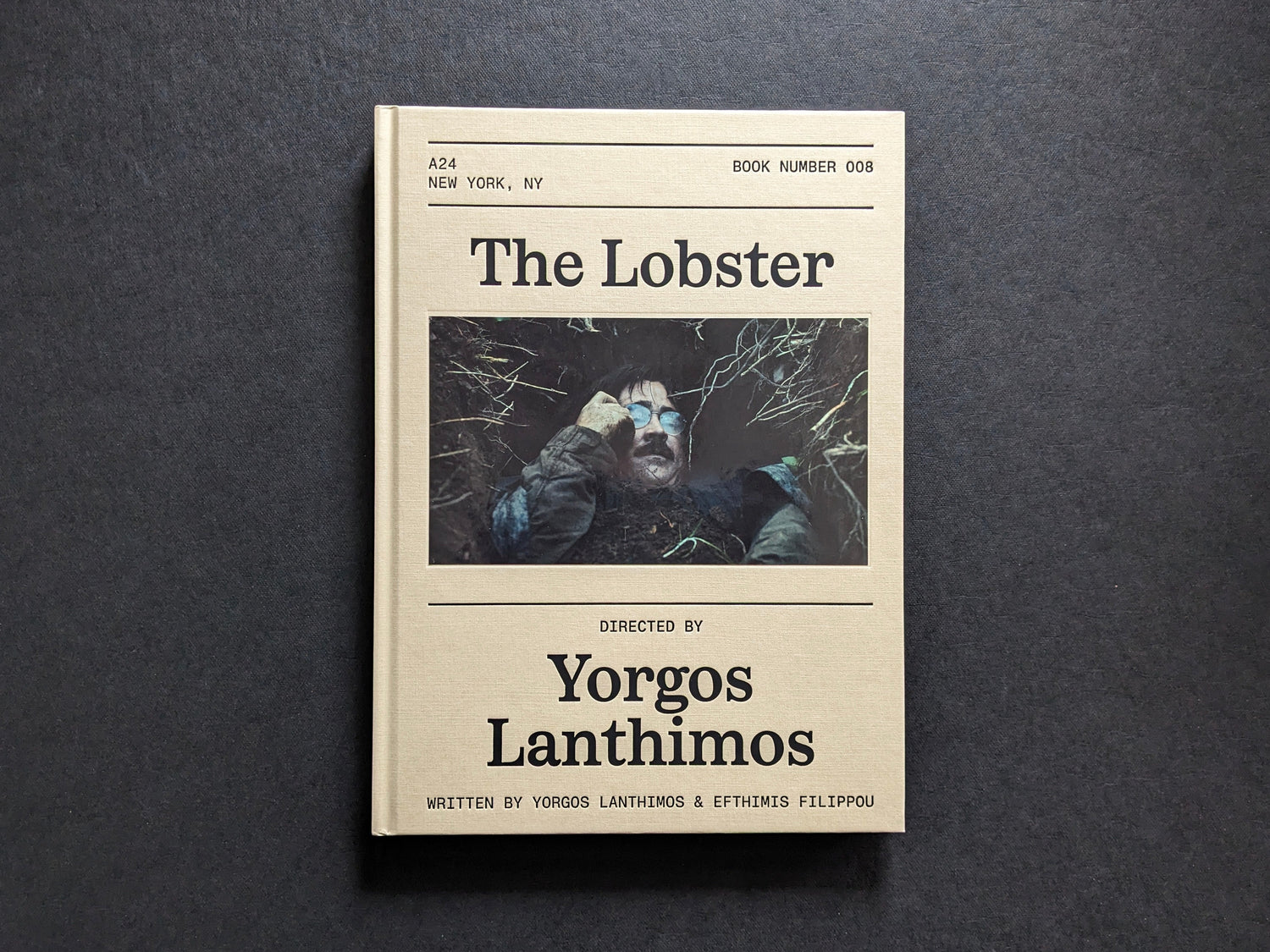 Front cover of The Lobster screenplay book by Yorgos Lanthimos, with a film still inset and A24 book design.
