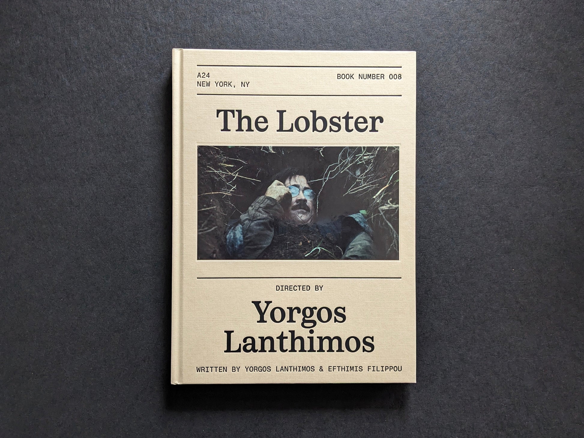 Front cover of The Lobster screenplay book by Yorgos Lanthimos, with a film still inset and A24 book design.