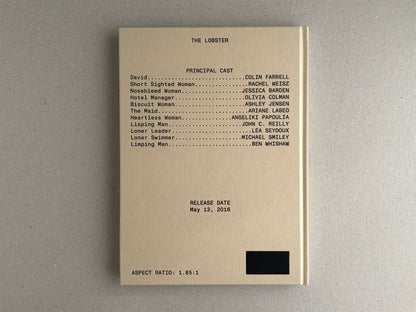 Front cover of The Lobster screenplay book, beige hardcover with cast list and release date printed on the cover.