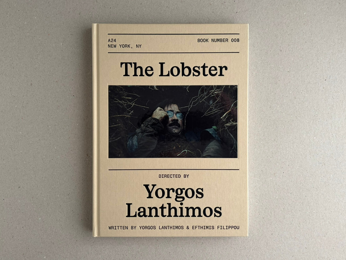 Front cover of The Lobster Screenplay Book by Yorgos Lanthimos, showing a beige debossed hardcover with a central film still and bold black title text.