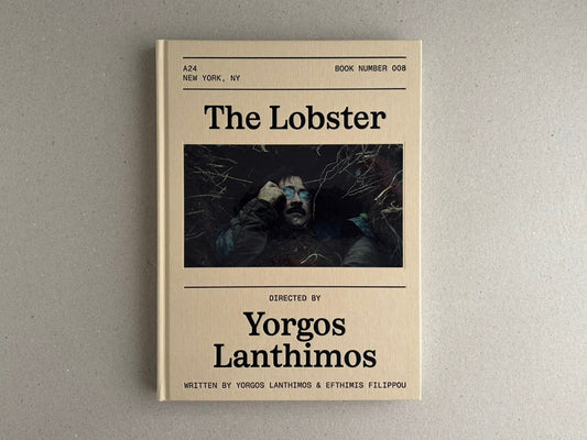 Front cover of The Lobster Screenplay Book by Yorgos Lanthimos, showing a beige debossed hardcover with a central film still and bold black title text.