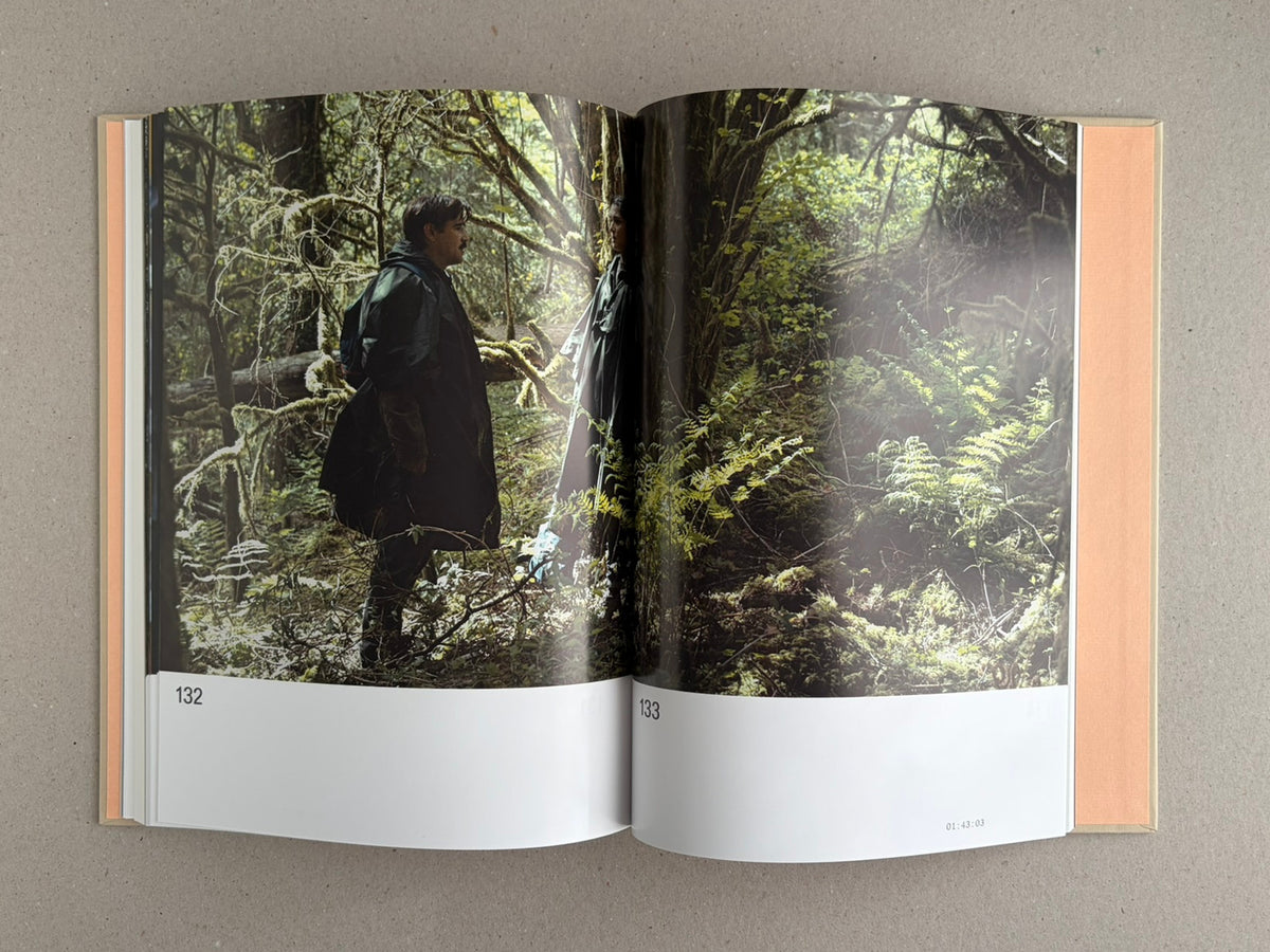 Open spread from The Lobster Screenplay Book showing a forest scene across pages 132-133.