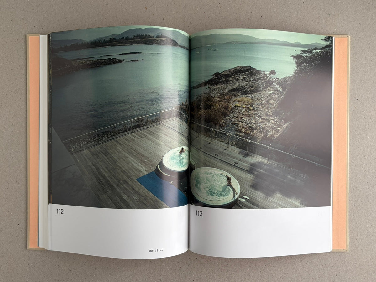 Open spread from The Lobster Screenplay Book showing a coastal pool scene across pages 112-113, with page numbers and a timecode at the bottom.